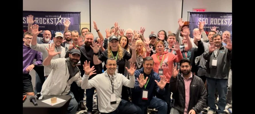 A group of conference attendees together in a community setting